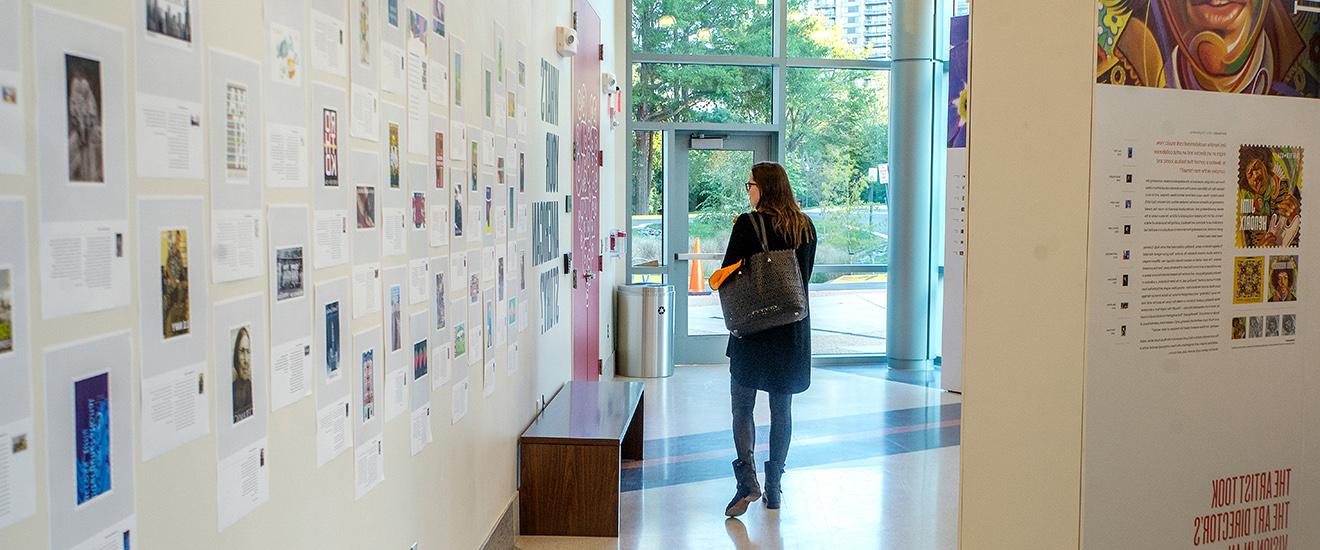 a student viewing art in a gallery